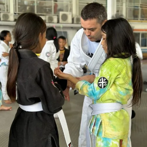 Kids receiving their first BJJ belts in Klong Toei